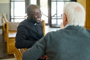 Smiling priest in a church